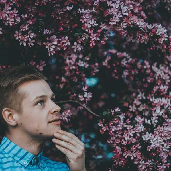 Person meditating peacefully, surrounded by soft light.